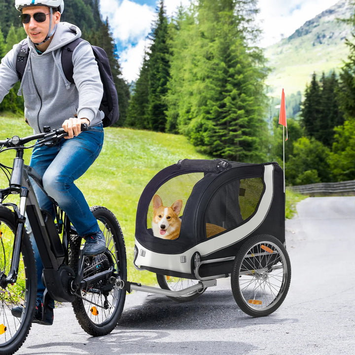 White and black dog bike trailer with steel frame and pneumatic tires for medium to large dogs